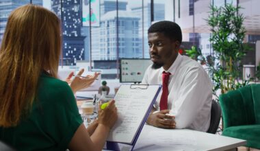 Professional recruiter reviewing resumes during a jobs and recruitment process